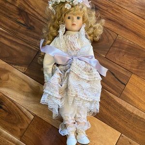 Vintage Porcelain doll on stand blond hair